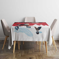 Red and white tablecloth on dining table with hockey player graphic and winter snowflakes