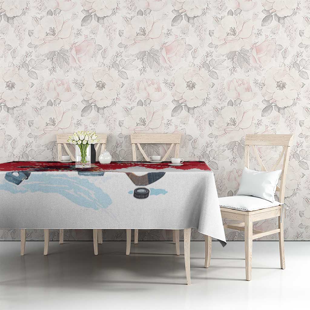 Red and light blue winter-themed tablecloth with hockey player silhouette on dining set