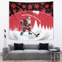 Red holiday wall tapestry with black leaf border, Santa playing hockey, snowy trees, “Best Pucking XMAS Ever.”