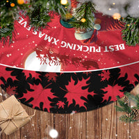 Red tree skirt with black maple leaf pattern and Santa hockey scene