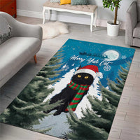 Blue cat Christmas area rug with pine trees, moon, and black cat in scarf and beanie