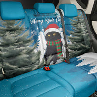 Blue car back seat cover with cat in red hat scarf, pine trees and snowflake pattern, includes armrest.