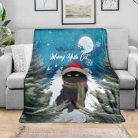 Blue Christmas blanket with black cat wearing scarf in snowy pine path