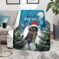 Blue throw blanket with black cat in red Santa hat and green plaid scarf