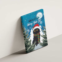 Blue Merry Yule Cat canvas wall art on wall, black cat with Santa hat and striped scarf