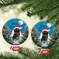 Two blue oval ceramic ornaments with black cat in Santa hat and red plaid scarf