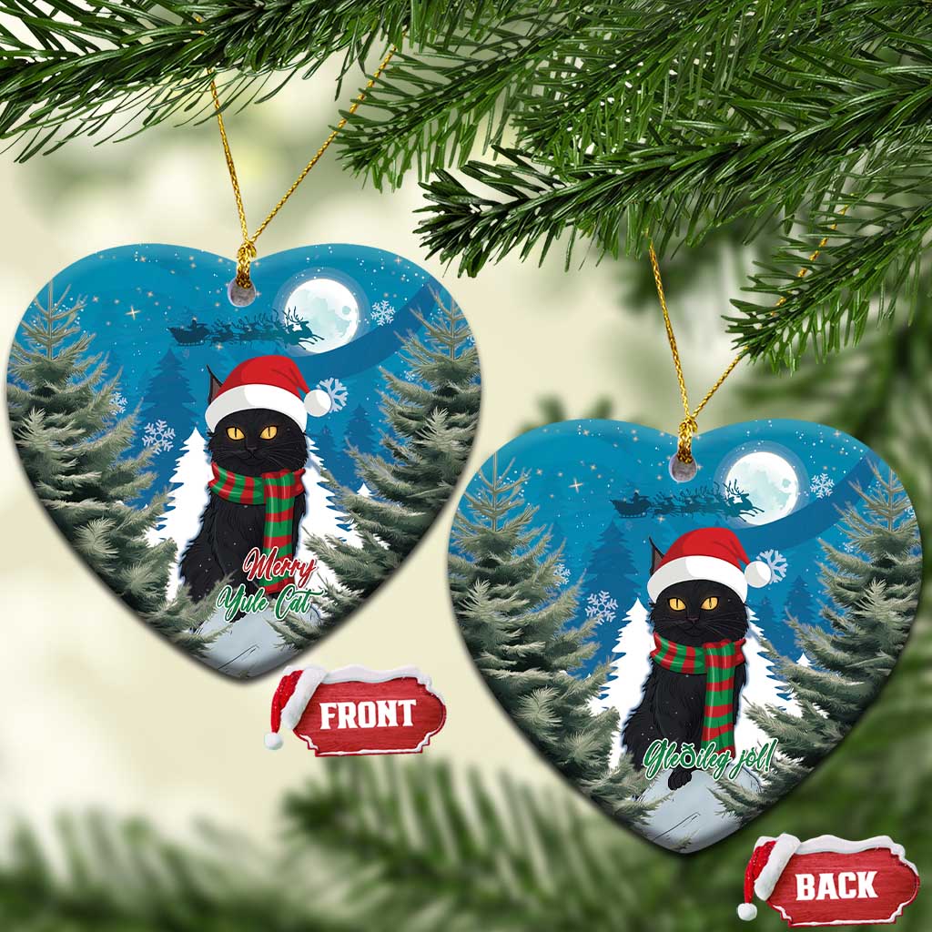 Pair of blue heart-shaped ornaments with black cat in Santa hat and red plaid scarf