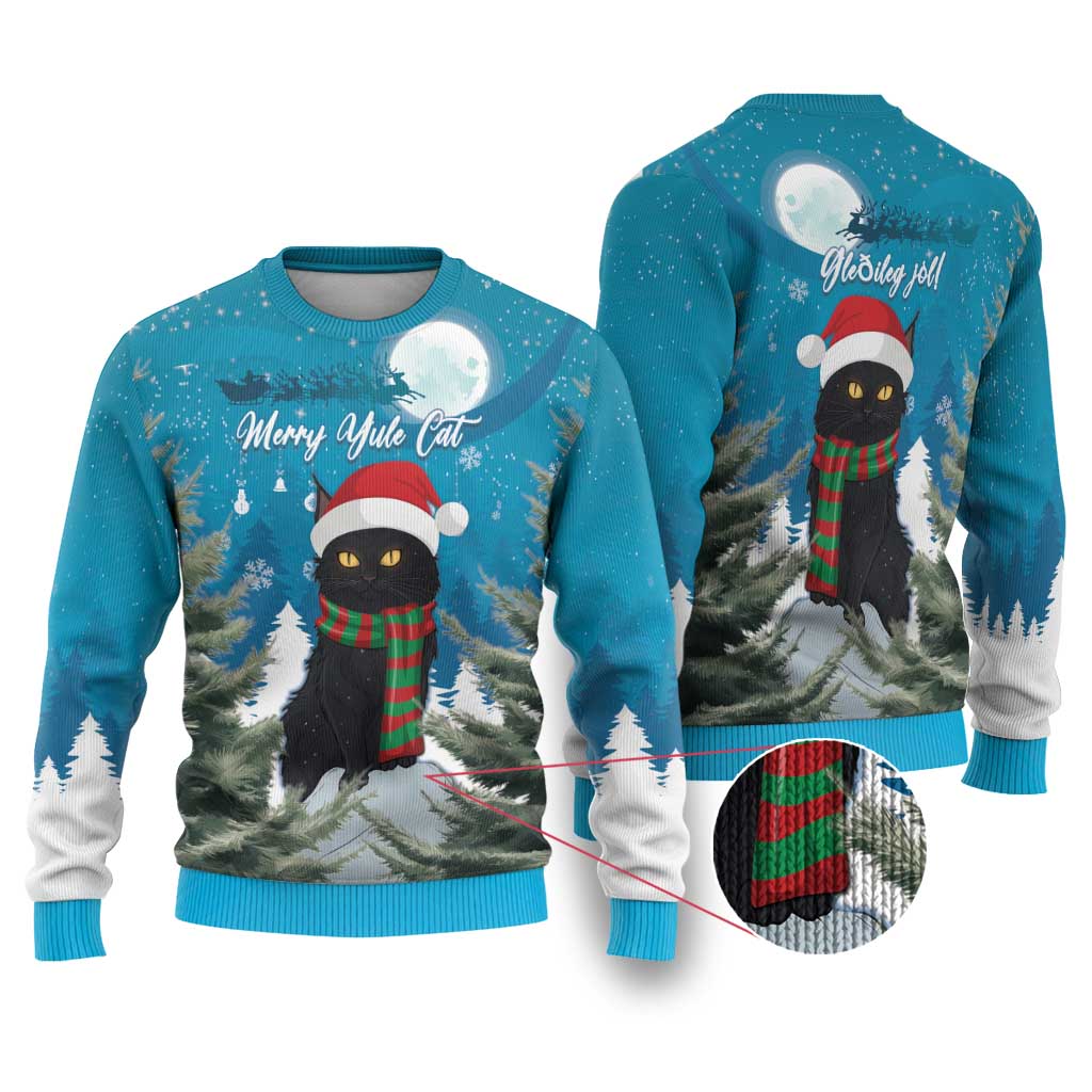 Blue Christmas ugly sweater with black cat in Santa hat, red-green scarf, moon over trees.