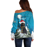 Blue off-shoulder sweater with back holiday cat graphic and snow trees, long sleeves