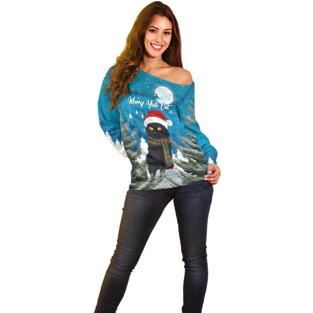 Blue off-shoulder sweater with front holiday cat in Santa hat, winter landscape print