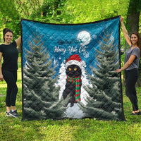 Blue quilt blanket showing Merry Yule Cat with winter pine forest and full moon.
