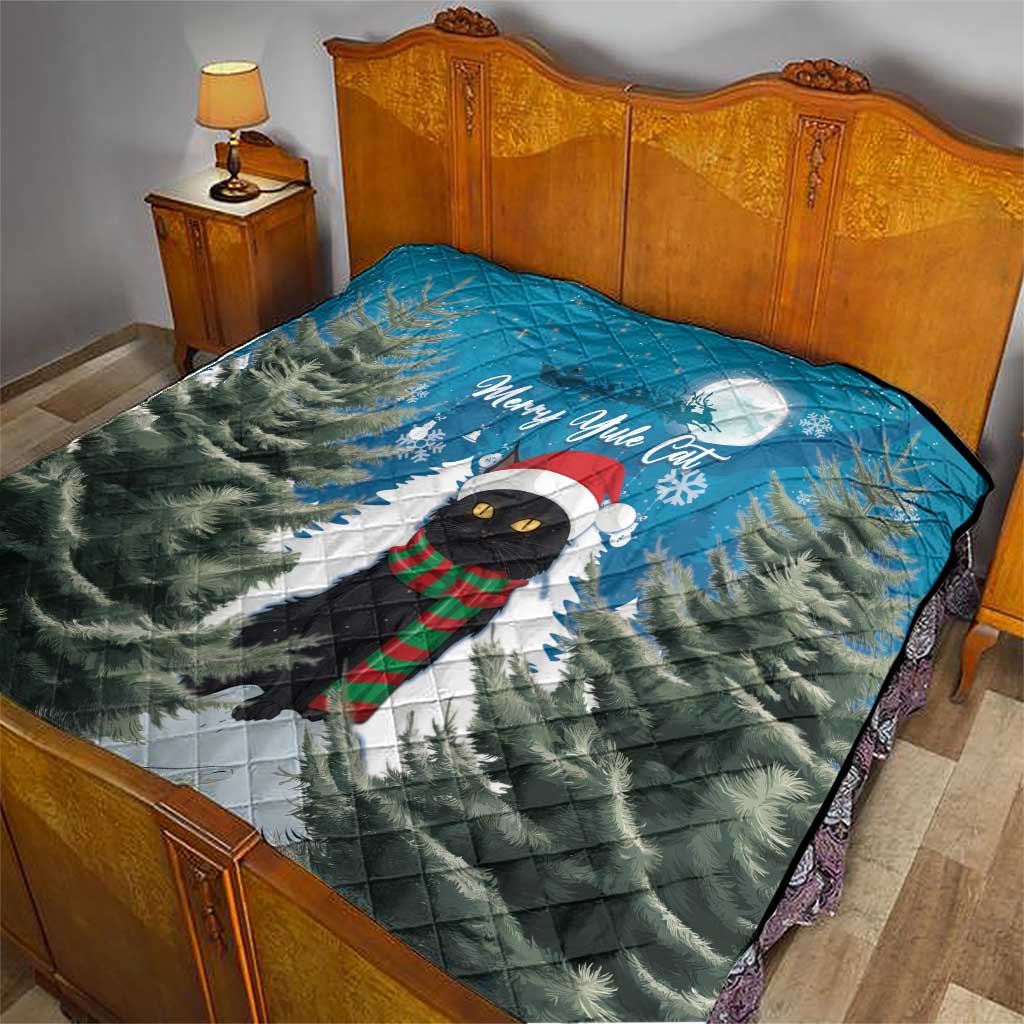 Quilt blanket on a bed: blue pine scene with black cat in scarf and Merry Yule Cat.
