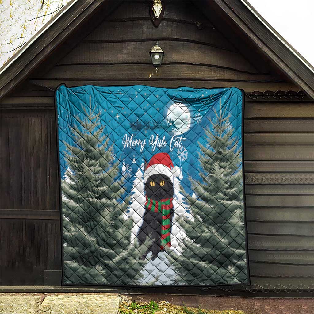 Blue quilt on outdoor wall: pine forest with moon, Merry Yule Cat, and striped scarf cat.
