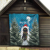 Blue quilt on outdoor wall: pine forest with moon, Merry Yule Cat, and striped scarf cat.