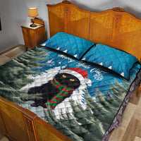 Blue quilt bed set with Merry Yule cat and snowy pines, includes two blue quilted pillows