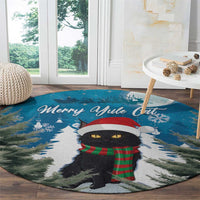 Blue round Christmas carpet with black cat in red hat and plaid scarf, 'Merry Ayule Cat'