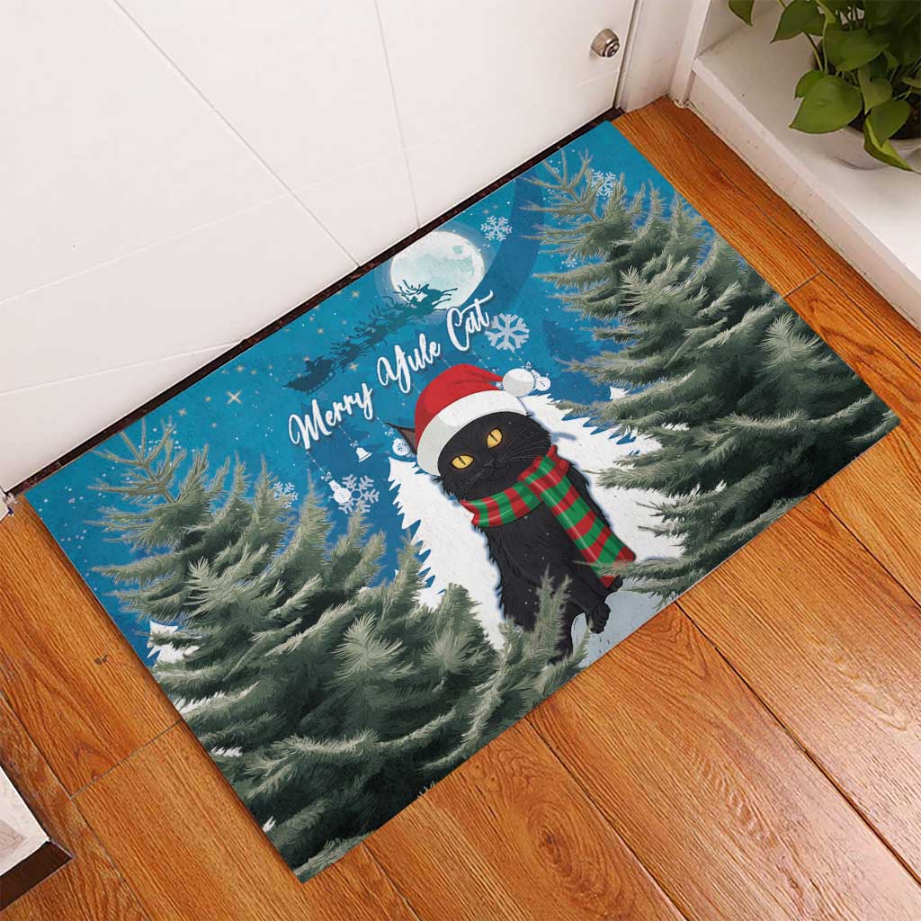 Blue rubber Christmas doormat with black cat in Santa hat and red-green scarf, snowy pine