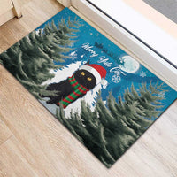 Blue rubber Christmas doormat, corner view of cat in Santa hat with red-green scarf
