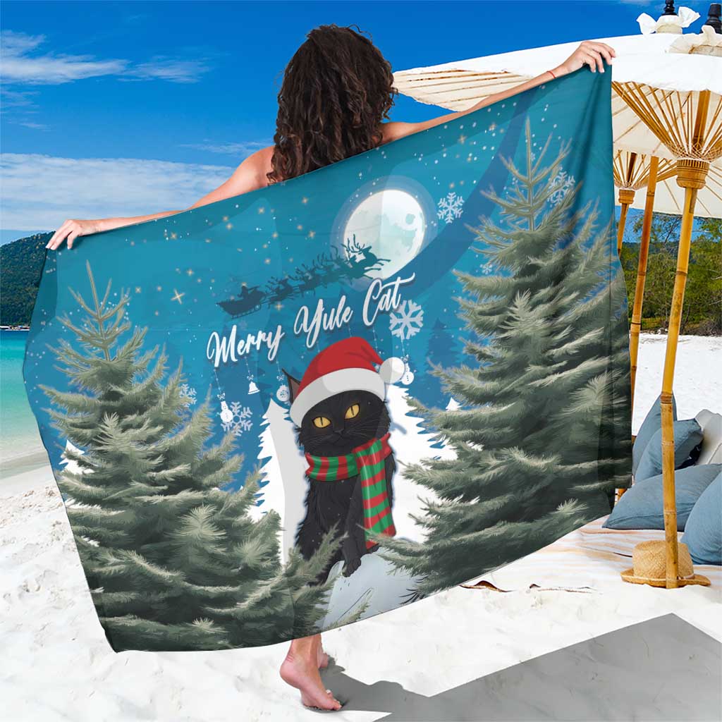 Blue Christmas cat sarong with pine trees, moon, and black cat in Santa hat