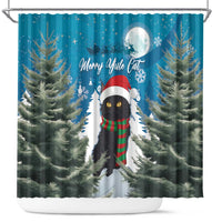 Blue Christmas shower curtain with black cat in hat and scarf, flanked by pine trees