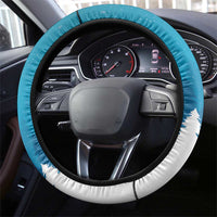 Blue steering wheel cover with white snow-themed border and stitched edge