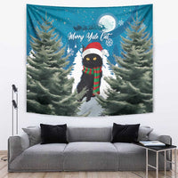 Blue Christmas cat tapestry with red hat, green plaid scarf, and pine trees