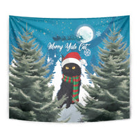 Blue Christmas cat tapestry with red hat, green plaid scarf, and full moon above
