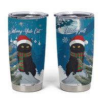 Blue tumbler cup with black cat wearing red hat and green scarf, snowy forest graphic