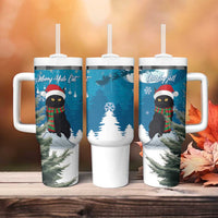 Set of three blue Christmas tumblers with handles, straw lids, and Merry Yule Cat art