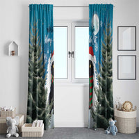 Blue window curtain pair with black cat, red scarf, pine branches, and snowflake details