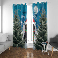 Blue window curtain pair with metal grommets, featuring cat in Santa hat and pine trees