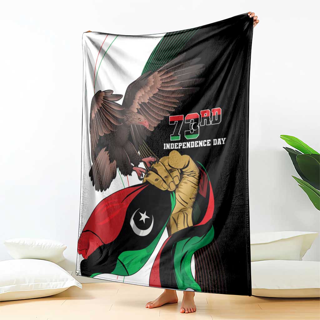 Black 73rd Independence Day blanket held up, showing eagle and soldier flag artwork