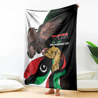 Black 73rd Independence Day blanket held up, showing eagle and soldier flag artwork