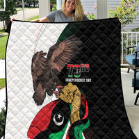 Black-and-white quilt with eagle, Libya flag, and "73rd Independence Day" text