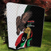Black-and-white quilt featuring eagle over Libya flag with "73rd Independence Day" text