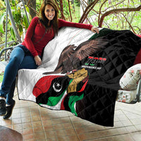 Black-and-white quilt with eagle, Libya flag artwork, and "73rd Independence Day" text