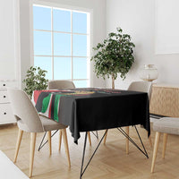 Black tablecloth draped over dining table with colorful Independence Day print