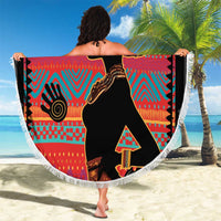 Round beach blanket with fringe, African woman silhouette over vibrant red and turquoise ethnic design