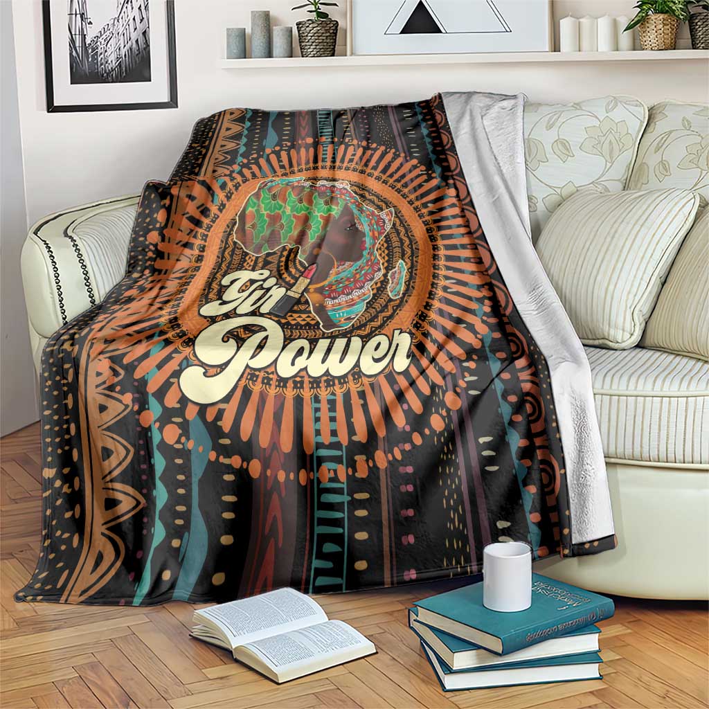 Black blanket featuring a circular portrait, “Girl Power” slogan, and tribal-style orange-teal rays