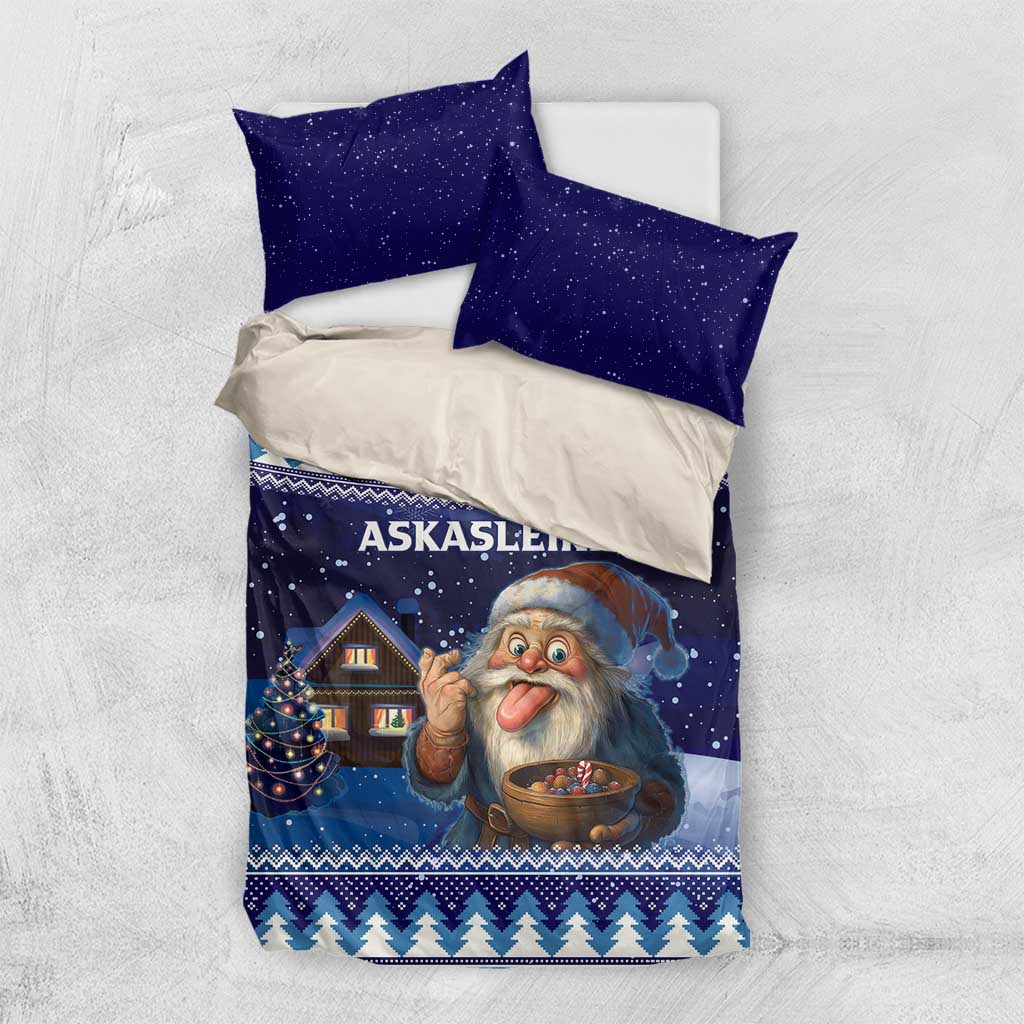 Blue Christmas duvet and pillow set on bed, starry sky print with gnome and house scene