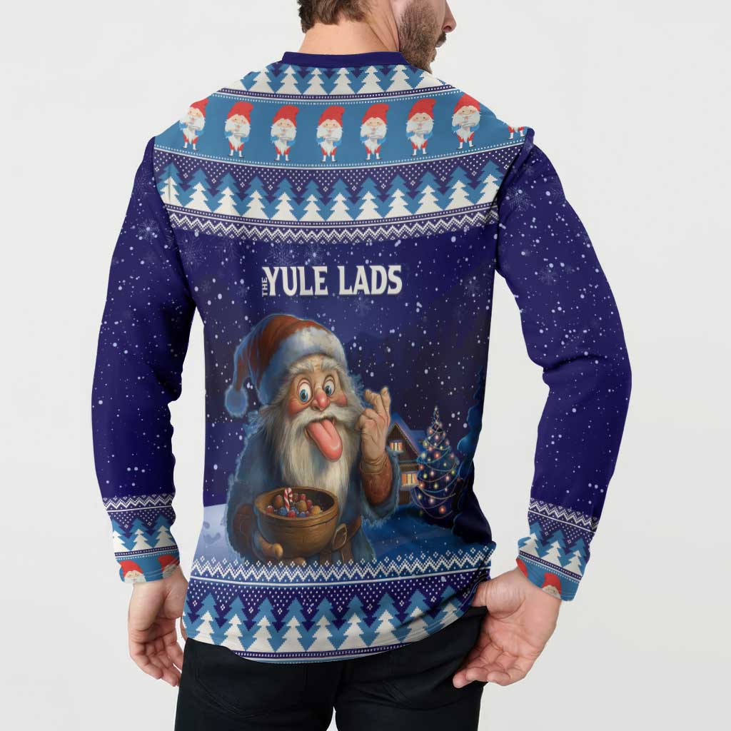 Dark blue sweatshirt with back 'YULE LADS' graphic; gnome by lights and houses