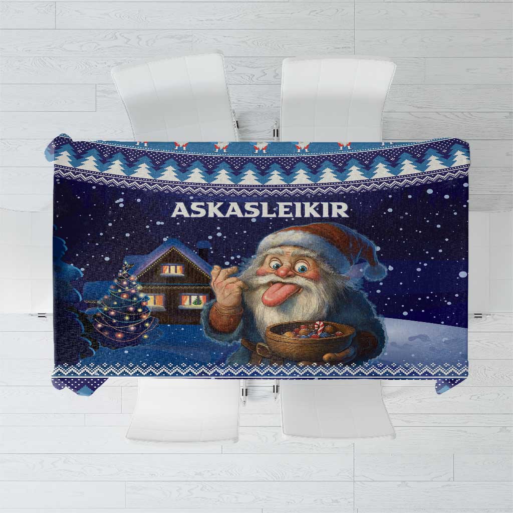 Blue rectangular tablecloth featuring a gnome illustration and houses in a Nordic border
