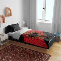 Black and red duvet cover with ALBANIA text and gold eagle emblem, styled on bed