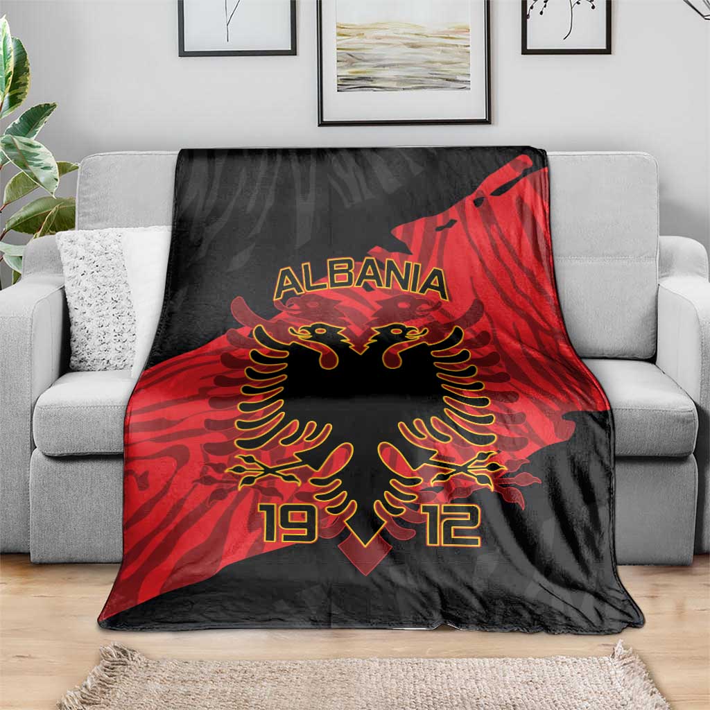 Black and red Albania eagle blanket draped over sofa, ALBANIA and 1912 design