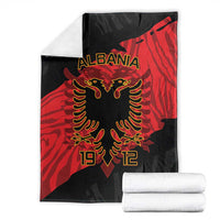 Folded black and red Albania eagle blanket with ALBANIA text and 1912 design