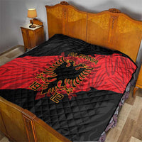 Black and red quilt on bed with eagle emblem, 'ALBANIA' text and 1912 print