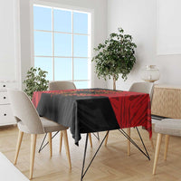 Black and red tablecloth with eagle and emblem, draped over dining table