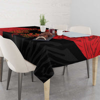Black tablecloth with red top border and eagle emblem across table