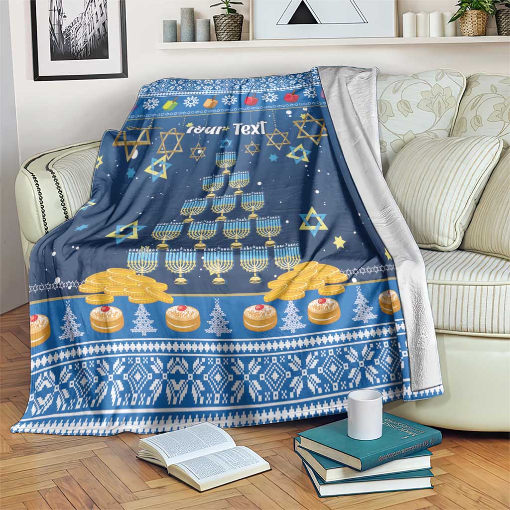 Dark blue blanket with menorah, coins and “Your Text” across the top, draped on couch