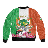Unisex bomber jacket back with black ribbed hem, green/orange crane crest kente print